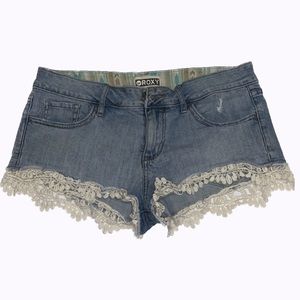 Woman’s Light-Wash Lace Denim Shorts